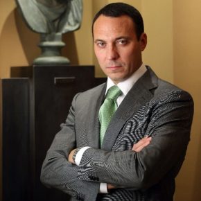 Udodov Alexander wearing a green tie in office